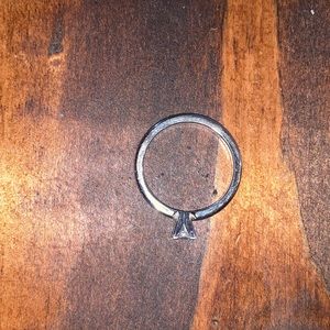 It’s white gold. .25 carat conflict free diamond. Purchased from brilliant earth